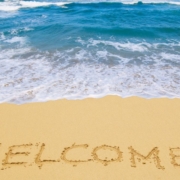 inscription_welcome_sand_sea_resort_waves