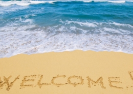 inscription_welcome_sand_sea_resort_waves