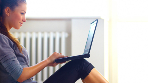 woman-writing-laptop-virtuagym